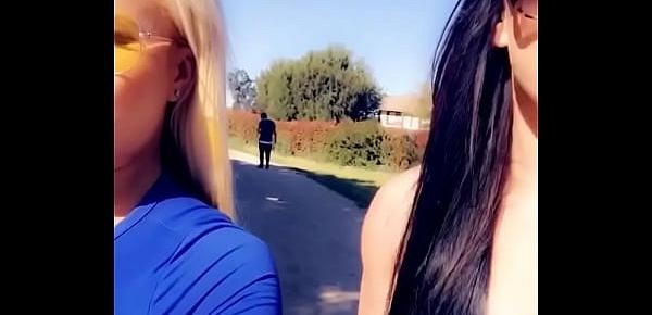  Two hot pornstars suck off a lucky fan in a public park